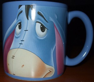 Large cute mug shaped like Eeyore, Mainly blue, pink, and black 